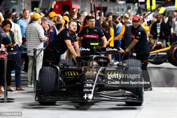 The crew of Alfa Romeo driver Zhou Guanyu of China on pit lane during the Formula 1 Heineken Silver Las Vegas Gran Prix on November 16, 2023 on the...