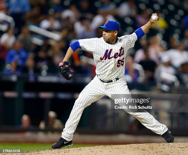 Pitcher Pedro Feliciano of the New York Mets elixirs a pitch against the Philadelphia Phillies on August 26, 2013 at Citi Field in the Flushing...