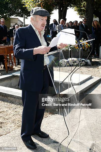 Humorist Popeck honors President of FIFA protocol Doctor Pierre Huth during Huth's funeral in Nogent Sur Marne cemetery on August 30, 2013 in...