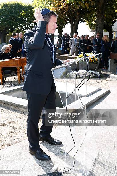 Actor Francis Huster honors President of FIFA protocol Doctor Pierre Huth during his Funeral in Nogent Sur Marne cemetery on August 30, 2013 in...