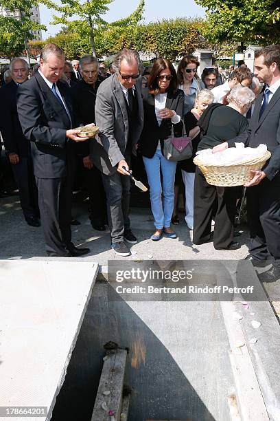 Humorist Michel Leeb with his wife Beatrice attend President of FIFA protocol Doctor Pierre Huth's Funeral in Nogent Sur Marne cemetery on August 30,...