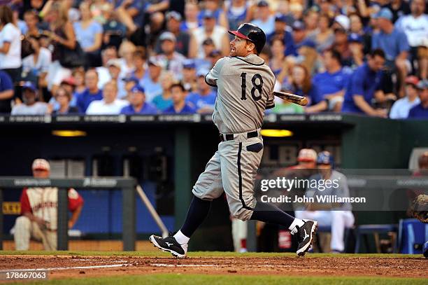 Chad Tracy of the Washington Nationals, wearing a Washington Homestead Grays replica uniform, bats against the Kansas City Royals on August 24, 2013...