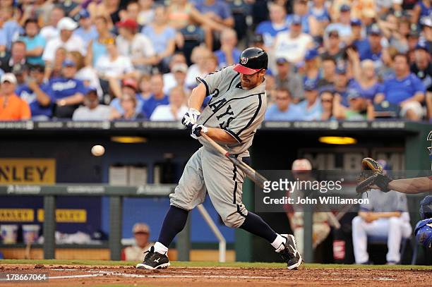 Chad Tracy of the Washington Nationals, wearing a Washington Homestead Grays replica uniform, bats against the Kansas City Royals on August 24, 2013...