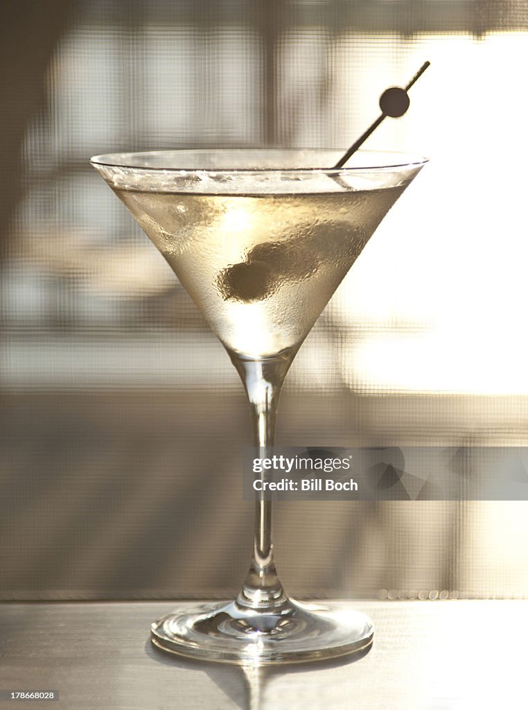 Elegant cocktail with three olives
