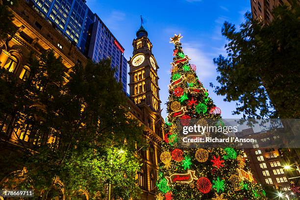 christmas tree & clock tower in martin place - christmas australia ストックフォトと画像