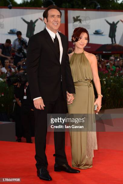 Actor Nicolas Cage and his wife Alice Kim Cage attend the 'Joe' Premiere during The 70th Venice International Film Festival at Palazzo Del Cinema on...