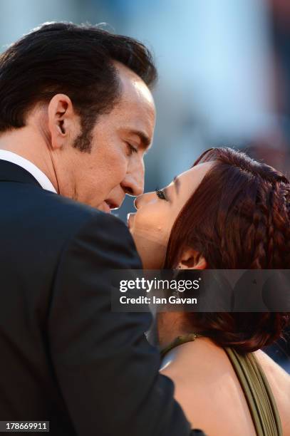 Actor Nicolas Cage kisses his wife Alice Kim Cage at the 'Joe' Premiere during The 70th Venice International Film Festival at Palazzo Del Cinema on...