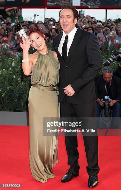 Actor Nicolas Cage and his wife Alice Kim attend 'Joe' Premiere during The 70th Venice International Film Festival at Sala Grande on August 30, 2013...