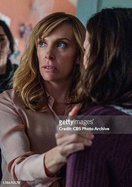 Pilot "-- Dr. Ellen Sanders holds her daughter Morgan , while armed intruder Sandrine watches them, on the series premiere of HOSTAGES Monday, Sept....