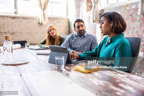 colleagues having discussion in modern conference room - human body part stock pictures, royalty-free photos & images