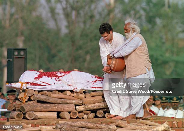 Rahul Gandhi, the son of Indian Prime Minister Rajiv Gandhi , at the funeral pyre during his cremation ceremony, on 24th May in New Delhi, India....