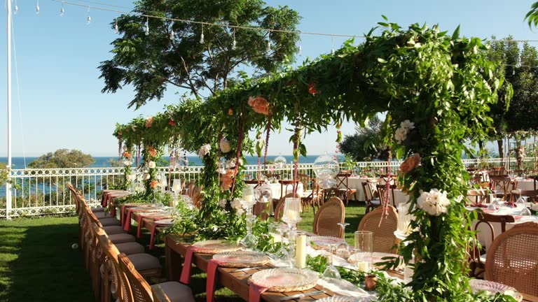 https://media.gettyimages.com/id/1786716570/video/table-setting-and-bride-and-groom-table-at-a-wedding-banquet-decorated-with-flowers.jpg?b=1&s=640x640&k=20&c=EPTIsvYLRb5MhlGvMStYOr4gmCTzy8KAkqFWTWpjdgs=