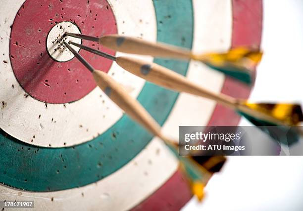 dart board with selective focus - objective stock pictures, royalty-free photos & images