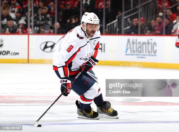 Alex Ovechkin of the Washington Capitals takes the puck during the first period against the New Jersey Devils at Prudential Center on November 10,...