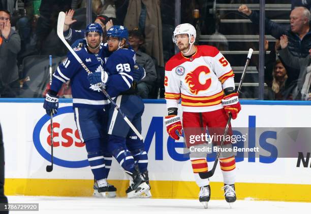 William Nylander of the Toronto Maple Leafs celebrates his first period goal against the Calgary Flames and is joined by John Tavares at Scotiabank...