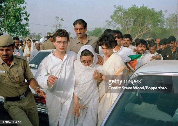 Rahul Gandhi, Sonia Gandhi and Priyanka Gandhi, the family of Indian Prime Minister Rajiv Gandhi , are surrounded by crowds as they arrive at his...