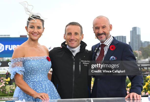 Michelle Payne, Damien Oliver and Glen Boss are seen ahead of Stakes Day at Flemington Racecourse on November 11, 2023 in Melbourne, Australia.