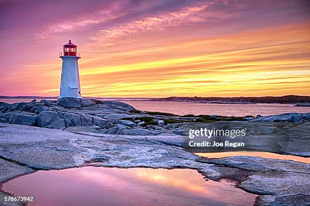 the light keeper - peggys cove stock-fotos und bilder