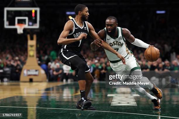 Jaylen Brown of the Boston Celtics drives to the basket past Mikal Bridges of the Brooklyn Nets during the first quarter of their In-Season...