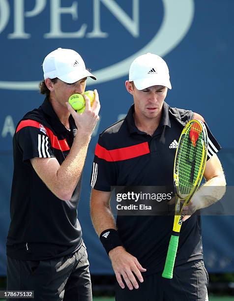 Jamie Murrary of Great Britain talks tactics with his partner John Peers of Australia during their men's doubles second round match against Feliciano...