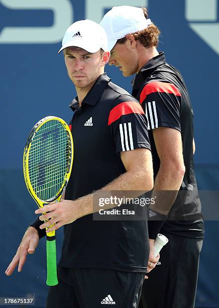 Jamie Murrary of Great Britain and his partner John Peers of Australia look on during their men's doubles second round match against Feliciano Lopez...