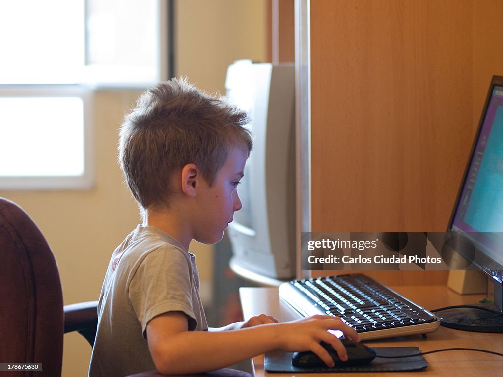 Kid Playing Computer Games High-Res Stock Photo - Getty Images