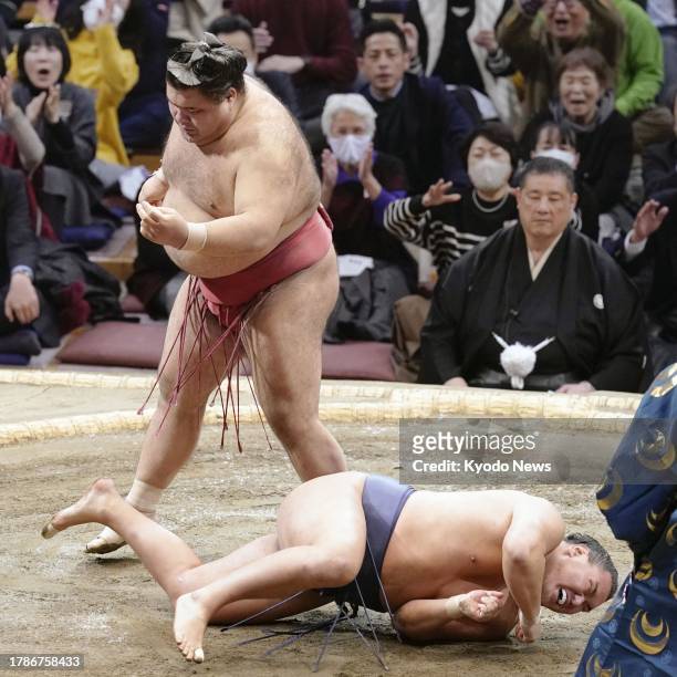 Maegashira Takayasu beats ozeki Hoshoryu on the sixth day of the Kyushu Grand Sumo Tournament at Fukuoka Kokusai Center in Fukuoka, southwestern...
