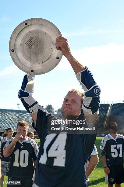 Drew Westervelt of the Chesapeake Bayhawks holds the championship trophy after beating the Charlotte Hounds 10-9 during the MLL Championship at PPL...