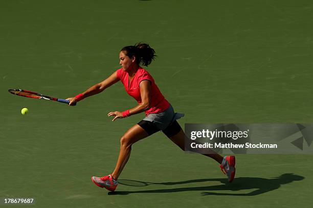 Jamie Hampton of the United States returns a shot during her women's singles third round match against Sloane Stephens of the United States on Day...