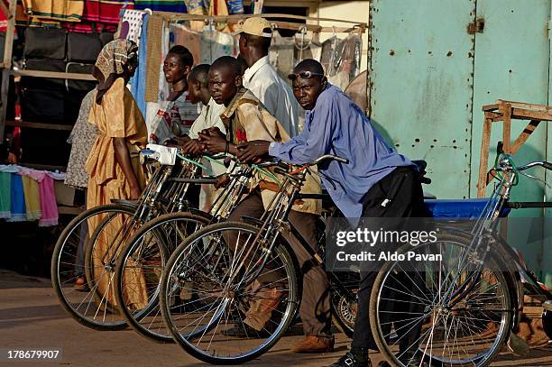 uganda, jinja, bike taxi drivers waiting - jinja uganda stock pictures, royalty-free photos & images