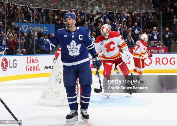 John Tavares of the Toronto Maple Leafs celebrates his second period goal against Dan Vladar of the Calgary Flames at Scotiabank Arena on November...