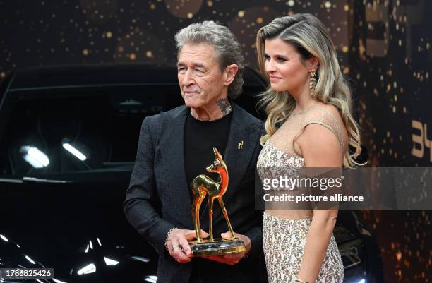 November 2023, Bavaria, Munich: Musician Peter Maffay and Hendrikje Balsmeyer stand on the red carpet at the Bambi awards ceremony at the Bavaria...