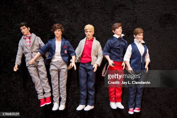 Dolls of the members of the pop band One Direction Zayn Malik, Louis Tomlinson, Harry Styles, Liam Payne, and Niall Horan are photographed for Los...