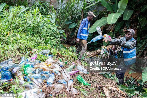 Volunteers from Sana Mare Organization, an environmental nonprofit remove plastic waste from Kiambu River following a heavy downpour that swept trash...