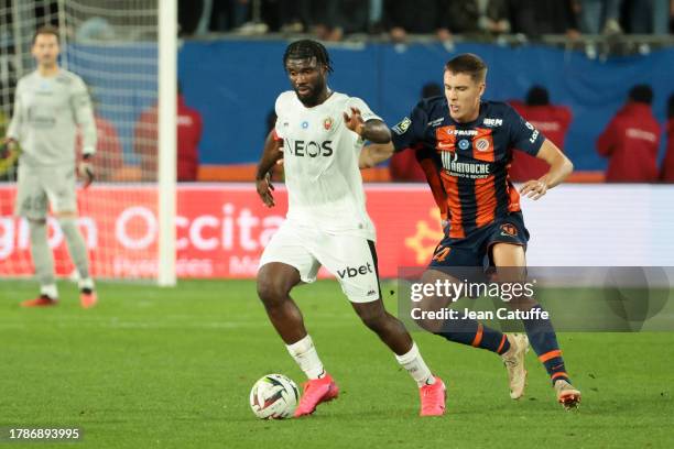 Terem Moffi of Nice, Maxime Esteve of Montpellier in action during the Ligue 1 Uber Eats match between Montpellier HSC and OGC Nice at Stade de la...