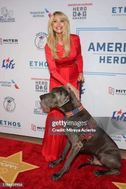 Christie Brinkley and dog, Maverick, attend the American Humane Hero Dog Awards at The Breakers on November 10, 2023 in Palm Beach, Florida.