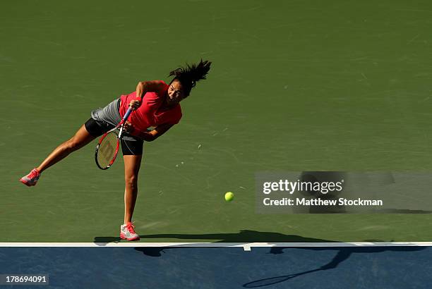 Jamie Hampton of the United States serves during their women's singles third round match Sloane Stephens of the United States on Day Five of the 2013...