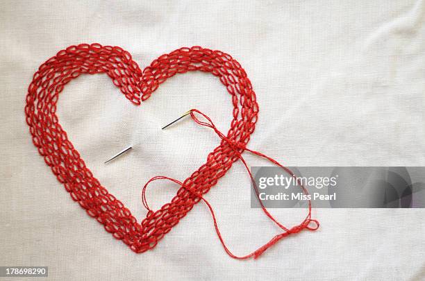 red love heart made with needle and thread - embroidery heart stock pictures, royalty-free photos & images