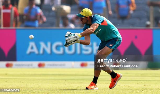 Mitchell Starc of Australia warms up ahead of the ICC Men's Cricket World Cup India 2023 between Australia and Bangladesh at MCA International...