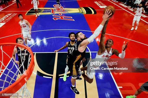 Jonas Valanciunas of the New Orleans Pelicans defends against Jabari Smith Jr. #10 of the Houston Rockets during the second half at Toyota Center on...