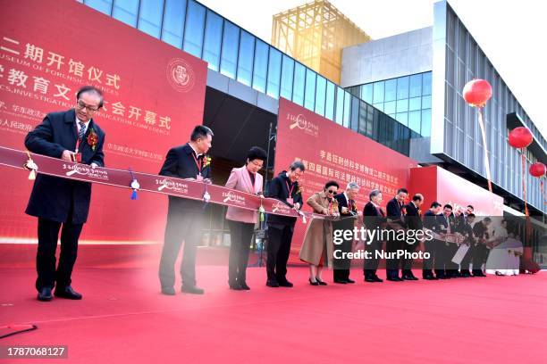 Dr. Henry Chang-Yu Lee and other guests cut the ribbon for the opening ceremony of the Henry Chang-Yu Lee Museum of Forensic Science in Nantong,...