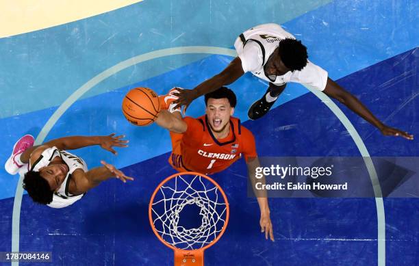 Chase Hunter of the Clemson Tigers attempts a basket against Barry Dunning Jr. #22 and Efrem Johnson of the UAB Blazers in the first half at Harrah's...