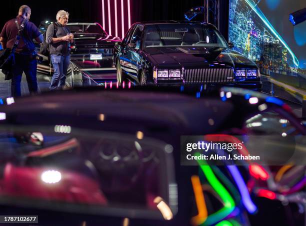 Los Angeles, CA Amidst the The Kevin Hart Kollection: auto enthusiasts and media view a 1987 Buick Grand National "Dark Knight" and in foreground, a...