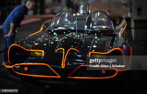 Los Angeles, CA An auto enthusiast views the Batmobile, which was formerly a Ford Futura, on display at Galpin Hall of Customs, by Galpin Auto...