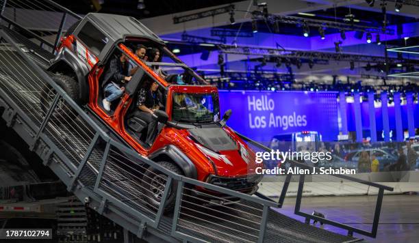 Los Angeles, CA People take a test drive in a Ford Bronco Raptor on Bronco Mountain during the Ford Bronco Indoor Thrill Ride at the LA Auto Show,...