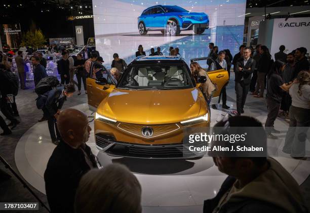 Los Angeles, CA Auto enthusiasts and media view the Acura all-electric ZDX Type S at the LA Auto Show, one of the world's largest auto and mobility...