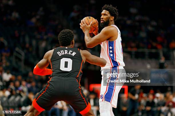 Joel Embiid of the Philadelphia 76ers looks to pass the ball against Jalen Duren of the Detroit Pistons in the first quarter of a game at Little...