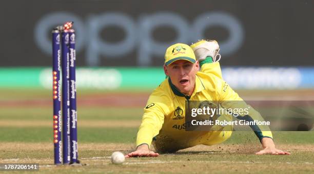 Marnus Labuschagne of Australia throws the ball as he runs out Mahmudullah of Bangladesh during the ICC Men's Cricket World Cup India 2023 between...