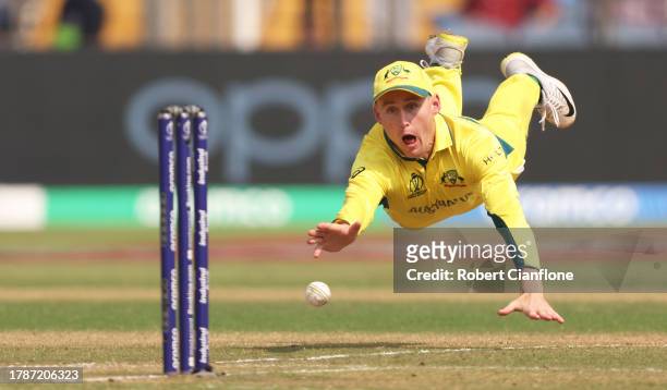 Marnus Labuschagne of Australia throws the ball as he runs out Mahmudullah of Bangladesh during the ICC Men's Cricket World Cup India 2023 between...