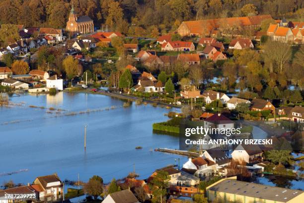 This aerial view shows the flooded village of Clairmarais, and its surroundings, northern France, where some 250 municipalities will be declared in a...